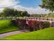 Stone bridge covered in bougainvillea on a well-manicured golf course at 3086 S First Water Ln, Gold Canyon, AZ 85118