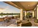 Spacious patio with comfortable seating, golf course and lake view perfect for entertaining at 3086 S First Water Ln, Gold Canyon, AZ 85118