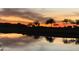 Sunset view with colorful sky reflecting in a pond on the golf course at 3086 S First Water Ln, Gold Canyon, AZ 85118