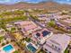 Picturesque aerial view of neighborhood homes showcasing solar panels, swimming pools and desert views providing a tranquil setting at 31020 N 5Th St, Phoenix, AZ 85085