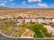 Aerial view of neighborhood featuring lush mature trees, playground, picnic tables, and gorgeous Arizona desert scenery at 31020 N 5Th St, Phoenix, AZ 85085