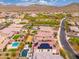 An overhead view of a desert neighborhood highlighting houses with solar panels and pools, offering privacy and energy efficiency at 31020 N 5Th St, Phoenix, AZ 85085