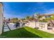 Relaxing backyard features a sparkling pool, artificial turf, basketball court and built in barbecue area with plenty of space at 31020 N 5Th St, Phoenix, AZ 85085