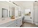 Bright bathroom with double vanity, large mirror, and soaking tub at 31020 N 5Th St, Phoenix, AZ 85085