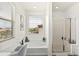 Relaxing bathroom with a soaking tub, walk-in shower, and scenic view at 31020 N 5Th St, Phoenix, AZ 85085