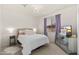 Charming bedroom with a plush bed, mirrored dresser, and lots of natural light at 31020 N 5Th St, Phoenix, AZ 85085