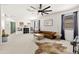 Second story bonus room with large windows, TV, ceiling fan, and comfortable leather sofa at 31020 N 5Th St, Phoenix, AZ 85085