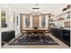 A spacious dining room featuring a large wooden table, stylish chandelier, and elegant decor for memorable gatherings at 31020 N 5Th St, Phoenix, AZ 85085