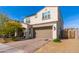 Charming two-story home featuring a two-car garage, desert landscaping, and brick paver driveway at 31020 N 5Th St, Phoenix, AZ 85085
