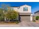 A well-maintained two-story home features a neutral color scheme, a two-car garage, and manicured landscaping at 31020 N 5Th St, Phoenix, AZ 85085
