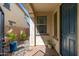 Close-up view of a front entry featuring a blue front door, welcoming decor, and beautiful stone accents at 31020 N 5Th St, Phoenix, AZ 85085