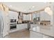 Well-lit kitchen features white cabinets, stainless steel appliances, and a granite countertop at 31020 N 5Th St, Phoenix, AZ 85085