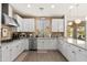 Spacious kitchen with white cabinets, stainless steel appliances, and granite countertops at 31020 N 5Th St, Phoenix, AZ 85085
