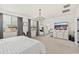 Spacious main bedroom features a white bed, large window, and bathroom access at 31020 N 5Th St, Phoenix, AZ 85085