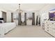 Spacious main bedroom with elegant chandelier, large windows and ample natural light at 31020 N 5Th St, Phoenix, AZ 85085