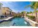 Private backyard oasis with a refreshing pool, cozy seating, and lush landscaping for serene outdoor living at 31020 N 5Th St, Phoenix, AZ 85085