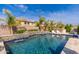 Sparkling pool with a waterfall feature and inviting bar area, perfect for outdoor entertaining at 31020 N 5Th St, Phoenix, AZ 85085