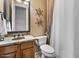 Cozy bathroom featuring a granite sink and vanity, toilet, and a shower and tub combo at 32020 N 20Th Dr, Phoenix, AZ 85085