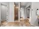 Bathroom featuring a large walk-in shower, dual sink vanity, tile flooring and sliding mirror closet doors at 32020 N 20Th Dr, Phoenix, AZ 85085
