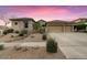 Charming single-story home with well-maintained landscaping and three-car garage at 32020 N 20Th Dr, Phoenix, AZ 85085