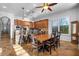 Spacious kitchen features stainless steel appliances, granite counters, an island bar, and adjoining breakfast nook at 32020 N 20Th Dr, Phoenix, AZ 85085