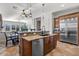 Kitchen featuring stainless steel appliances, dark wood cabinets, tile floors and an adjoining breakfast nook at 32020 N 20Th Dr, Phoenix, AZ 85085