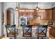 Kitchen featuring stainless steel appliances, granite countertops, stone accents, and beautiful dark wood cabinets at 32020 N 20Th Dr, Phoenix, AZ 85085