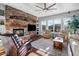Bright living room with a cozy fireplace, stone accents, recessed lighting, and an open floor plan at 32020 N 20Th Dr, Phoenix, AZ 85085