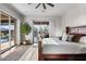 Main bedroom featuring a king bed, recessed lighting, slider to backyard pool, and access to the outdoors at 32020 N 20Th Dr, Phoenix, AZ 85085