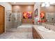 Spa-like bathroom with glass enclosed shower, soaking tub, and tile floors at 33269 N 73Rd Pl, Scottsdale, AZ 85266