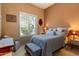 Cozy bedroom featuring a queen-sized bed and shuttered windows allowing ample natural light at 33269 N 73Rd Pl, Scottsdale, AZ 85266