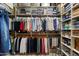 Spacious walk-in closet with organized shelving and hanging rods for ample storage and organization at 33269 N 73Rd Pl, Scottsdale, AZ 85266
