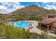 Aerial view showcases community pool with desert landscaping surrounded by lounge seating at 33269 N 73Rd Pl, Scottsdale, AZ 85266
