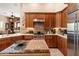Beautiful kitchen with an island, stainless appliances, and wooden cabinets at 33269 N 73Rd Pl, Scottsdale, AZ 85266