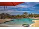 Community pool on a bright sunny day with comfortable lounge chairs and beautiful mountain views at 33269 N 73Rd Pl, Scottsdale, AZ 85266