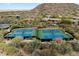 Aerial view of community tennis courts, showcasing the well-maintained facilities and scenic surroundings at 33269 N 73Rd Pl, Scottsdale, AZ 85266