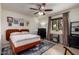 Cozy bedroom with warm lighting, modern furnishings, and a large window with curtains at 3516 W Brown St, Phoenix, AZ 85051