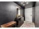 Welcoming entryway with modern console, mirror, and tiled floors, creating an inviting and stylish foyer at 3516 W Brown St, Phoenix, AZ 85051