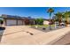 Attractive home with solar panels, mature landscaping, and a 'For Sale' sign, ready for its new owners at 3516 W Brown St, Phoenix, AZ 85051