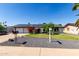 Attractive home featuring solar panels, well-maintained landscaping, and a 'For Sale' sign in a desirable location at 3516 W Brown St, Phoenix, AZ 85051