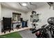 Home gym with high end exercise equipment, custom lighting, and rubber flooring at 3516 W Brown St, Phoenix, AZ 85051