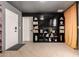 Modern living room featuring a built-in bookshelf and a television at 3516 W Brown St, Phoenix, AZ 85051