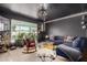 Stylish living area with unique decor, featuring a comfortable seating area and abundant natural light at 3516 W Brown St, Phoenix, AZ 85051
