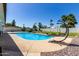 Private backyard pool with lounge chair and desert landscaping at 3516 W Brown St, Phoenix, AZ 85051