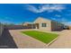 View of home's backyard featuring a small grassy patch and gravel at 3597 E Appaloosa Dr, San Tan Valley, AZ 85140