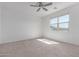 Bright bedroom with a large window and ceiling fan, offering a comfortable living space at 3597 E Appaloosa Dr, San Tan Valley, AZ 85140