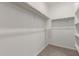 Walk-in closet offering ample storage space with built-in shelving and hanging rods for organization at 3597 E Appaloosa Dr, San Tan Valley, AZ 85140