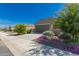 Well-maintained home featuring desert landscaping, a concrete driveway, and a two-car garage at 3597 E Appaloosa Dr, San Tan Valley, AZ 85140