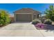 Charming single-story home with a two-car garage, desert landscaping, and a welcoming facade at 3597 E Appaloosa Dr, San Tan Valley, AZ 85140