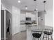 Bright kitchen boasts granite counters, stainless steel appliances, and modern pendant lighting at 3597 E Appaloosa Dr, San Tan Valley, AZ 85140
